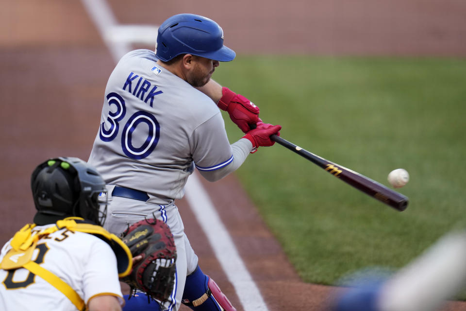 Toronto Blue Jays' Alejandro Kirk doubles off Pittsburgh Pirates starting pitcher Johan Oviedo, driving in a run, during the first inning of a baseball game in Pittsburgh, Saturday, May 6, 2023. (AP Photo/Gene J. Puskar)