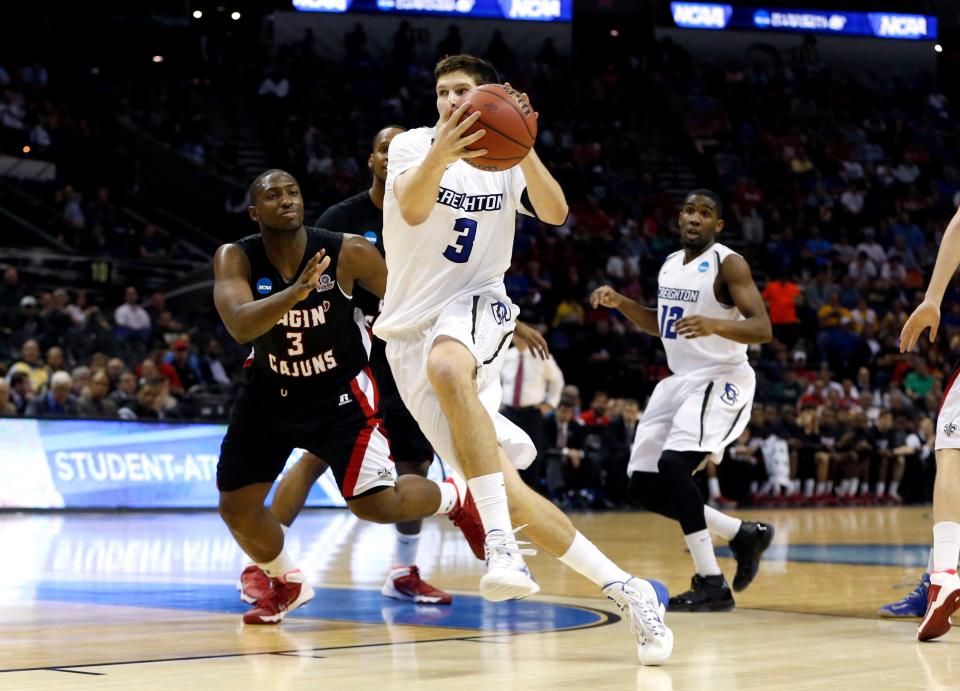 Mar 21, 2014; San Antonio, TX, USA; Creighton Bluejays forward Doug McDermott (3) drives against Louisiana Lafayette Ragin Cajuns guard Xavian Rimmer (3) in the second half of a men's college basketball game during the second round of the 2014 NCAA Tournament at AT&T Center. Mandatory Credit: Kevin Jairaj-USA TODAY Sports