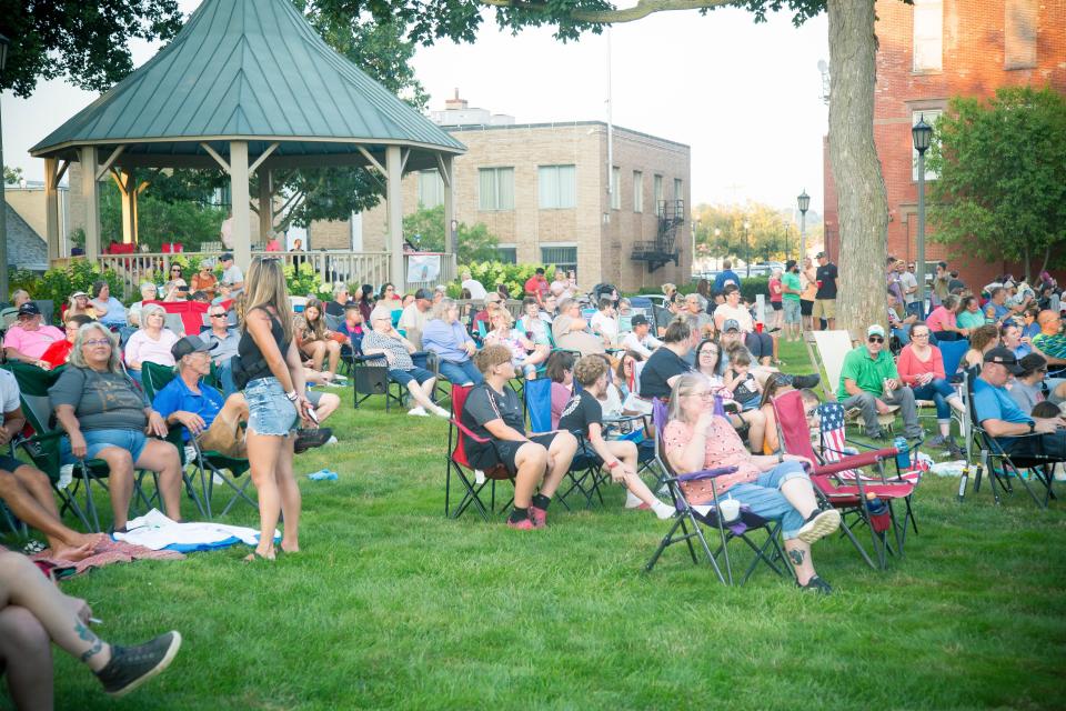Country music fans fill the lawn of the court square for Claudia Hoyser's performance on Friday night. Thousands of fans have turned out for each of the concerts this year.