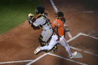 Baltimore Orioles' Jorge Mateo scores on a double by Brett Phillips, next to Pittsburgh Pirates catcher Jason Delay during the second inning of a baseball game Saturday, Aug 6, 2022, in Baltimore. (AP Photo/Terrance Williams)