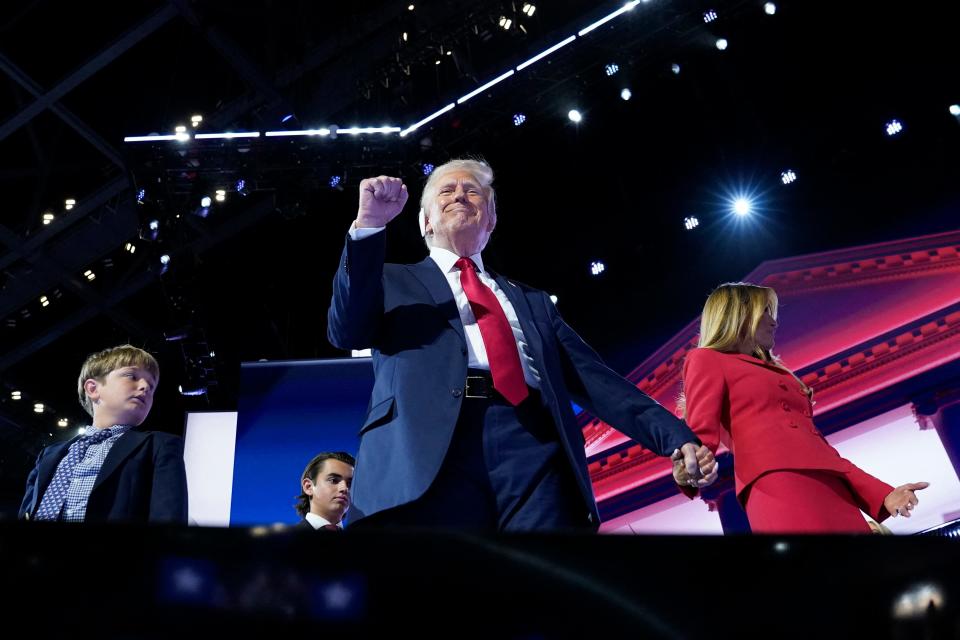 GOP presidential nominee Donald Trump is joined on stage by wife Melania after he finished giving his acceptance speech on July 18, 2024, at the RNC.