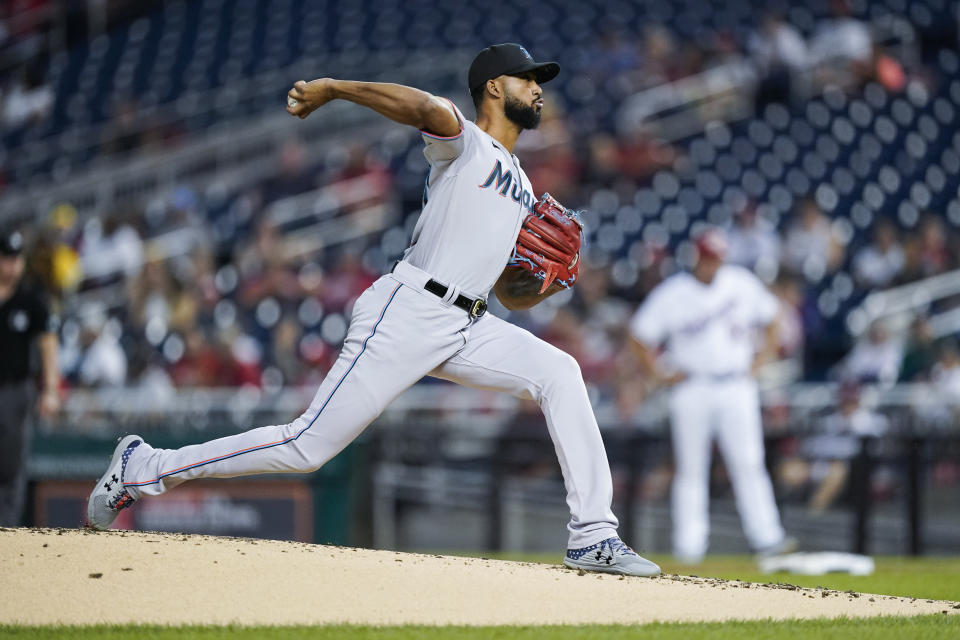 FILE - Miami Marlins starting pitcher Sandy Alcantara throws during the first inning of a baseball game against the Washington Nationals at Nationals Park, Monday, Sept. 13, 2021, in Washington. The Miami Marlins are finalizing an extension with right-hander Sandy Alcantara and have reached an agreement with free agent outfielder Avisail Garcia, a person with knowledge of the situations said Sunday, Nov. 28. (AP Photo/Alex Brandon, File)