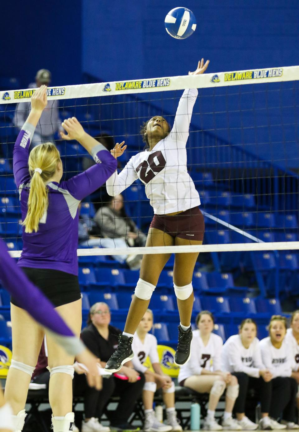 Caravel’s Laila Glover goes up for a kill attempt during Delmarva Christian’s 2-0 win over Caravel in the third-place game at the Bob Carpenter Center, Nov. 14, 2022.