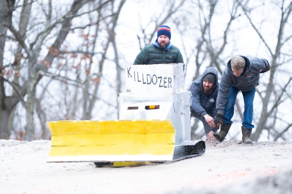 The 'Killdozer' sled sets up at the top of the race route during the Festivus Cardboard Sled Competition at Leila Arboretum on Saturday, Feb. 10, 2024.