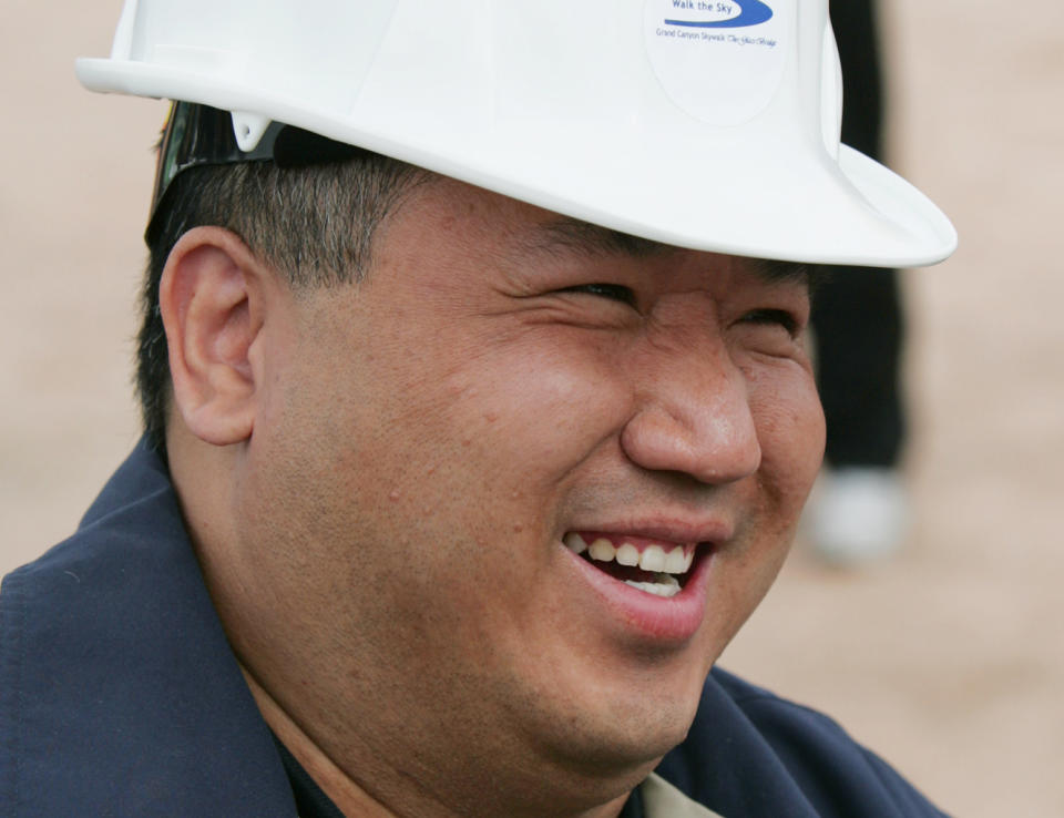 FILE- In this file photo taken March 7, 2007, David Jin is all smiles at the rollout for the Skywalk on the Hualapai Indian Reservation in Grand Canyon West, Ariz. A representative says Jin the Chinese tour operator and Las Vegas businessman and who built the Grand Canyon Skywalk attraction in northwestern Arizona has died in Los Angeles. A Grand Canyon Skywalk Development spokesman said that Jin died Thursday June 13, 2013 at UCLA Medical Center after a four-year battle with cancer. He was 51. (AP Photo/Ross D. Franklin, File)
