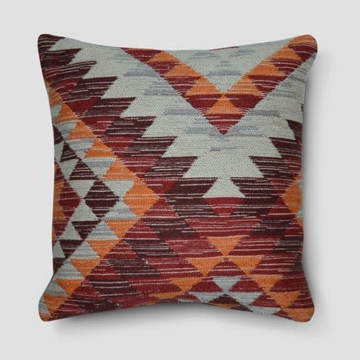 Get it <a href="https://www.target.com/p/kilim-wool-throw-pillow-18-red-threshold-153/-/A-52409330#lnk=newtab" target="_blank">here</a>.&nbsp;