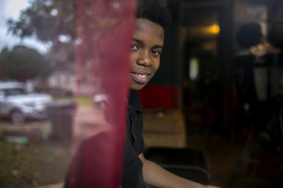 Joshua K. Love Jr. looks out from the living room of his father's home in Greenwood, Miss., Saturday, June 8, 2019. (AP Photo/Wong Maye-E)
