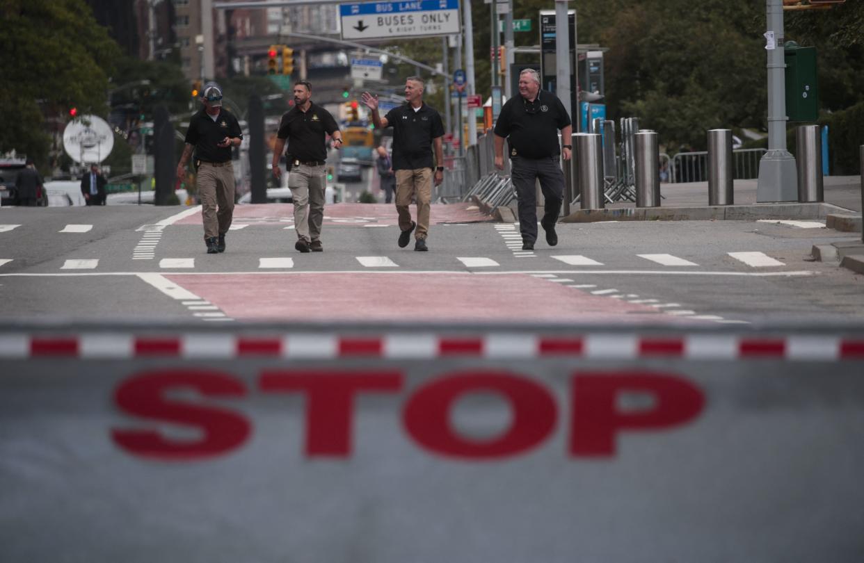 Security guards walk outside the UN headquarters during the high-level 76th session of the UN General Assembly taking place on on Sept. 20, 2021, in New York.