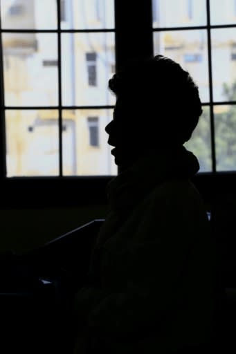 Nine years after a Sudanese judge oversaw her flogging, "Halima Abdalla" (in silhouette) remains broken and bitter