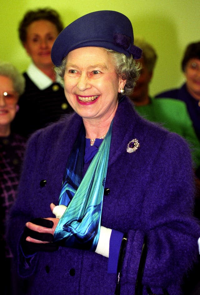 The Queen with her arm in a sling, injured when she fell from a horse 