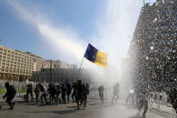 A jet of water is released on demonstrators during a protest calling for changes in the education system in Santiago, Chile April 11, 2017. REUTERS/Ivan Alvarado