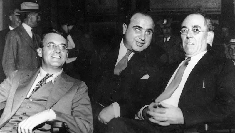 Al Capone is seen in federal court in Chicago on Oct. 7, 1931, during his tax evasion trial with his attorneys Michael Ahern, left, and Albert Fink. (