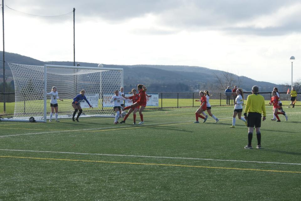 A New Hartford player takes a shot vs Section V's Spencerport on November 12, 2022, at the Class A Girls Soccer New York State Semifinals in Cortland, NY. The Spartans defeated the Rangers 1-1 (6-5) in Penalty Kicks