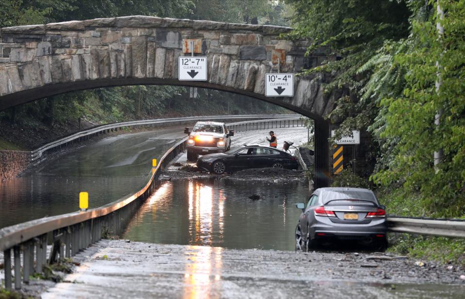 Cars still litter the flooded northbound side of the Bronx River Parkway off of Paxton Avenue in Bronxville Sept. 30, 2023, after heavy rains the day before.