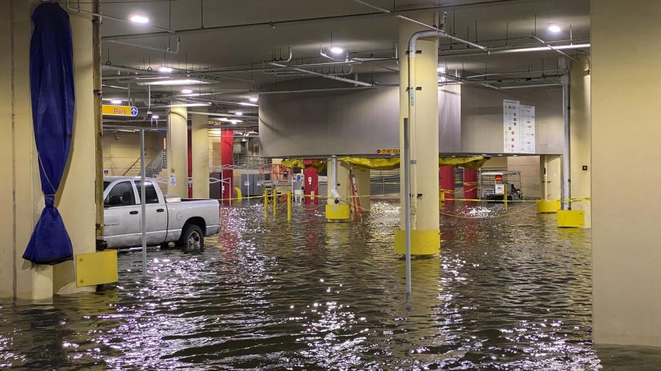 Flooding is seen at Tampa General Hospital as Tropical Storm Eta sends torrential downpours, storm surge flooding and wind across the Tampa Bay Area on Thursday, Nov. 12, 2020. (Luis Santana/Tampa Bay Times via AP)