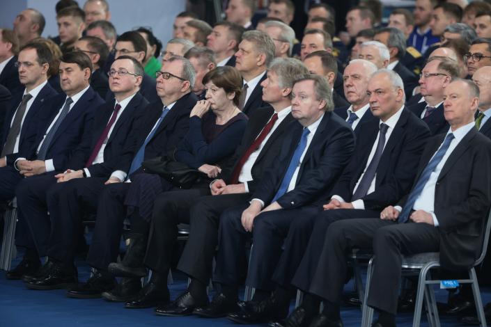 Participants listen to Putin's address on Tuesday. 