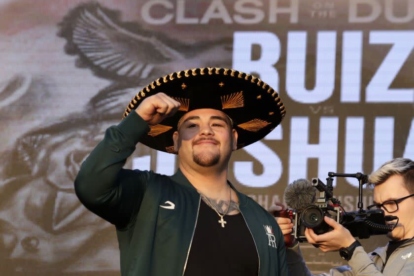Heavyweight boxer Andy Ruiz Jr. of Mexico waves during a weigh-in at Faisaliah Center, in Riyadh, Saudi Arabia, Friday, Dec. 6, 2019. The first ever heavyweight title fight in the Middle East, has been called the "Clash on the Dunes." Will take place at the Diriyah Arena on Saturday. (AP Photo/Hassan Ammar)