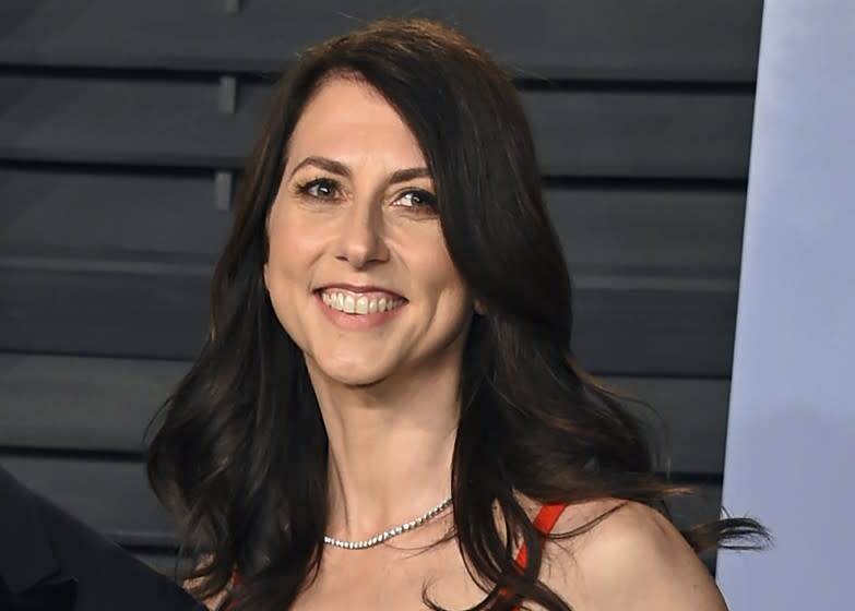 FILE - In this March 4, 2018, file photo, then-MacKenzie Bezos arrives at the Vanity Fair Oscar Party in Beverly Hills, Calif. MacKenzie Scott stormed the philanthropy world in 2020 with $5.7 billion in unrestricted donations to hundreds of charities. The seven- and eight-figure gifts were the largest many had ever received. At the time, few people understood the multiplier effect those gifts would have or how truly wide a net she was casting. (Photo by Evan Agostini/Invision/AP, File)