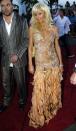 <p>Paris Hilton had nothing to hide in this completely sheer embellished dress in 2004.</p>