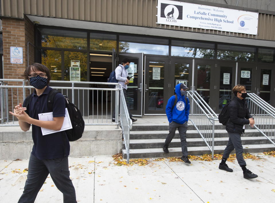 Students from Lasalle Community Comprehensive High School walk out of class to protest COVID-19 safety concerns Thursday, Oct. 1, 2020 in Montreal.  (Ryan Remiorz/The Canadian Press via AP)