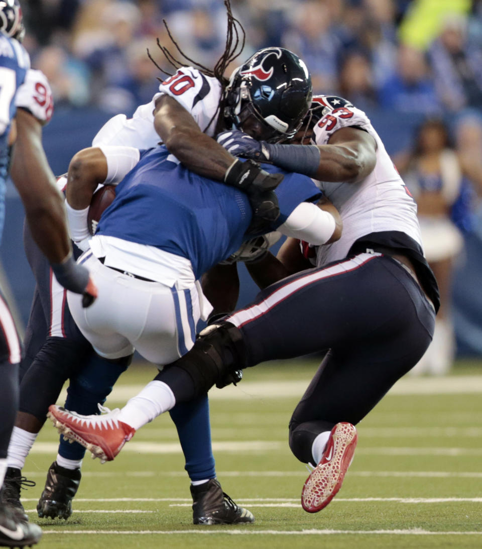 <p>Indianapolis Colts quarterback Jacoby Brissett (7) is sacked by Houston Texans’ Jadeveon Clowney (90) and Joel Heath (93) during the first half of an NFL football game, Sunday, Dec. 31, 2017, in Indianapolis. (AP Photo/AJ Mast) </p>