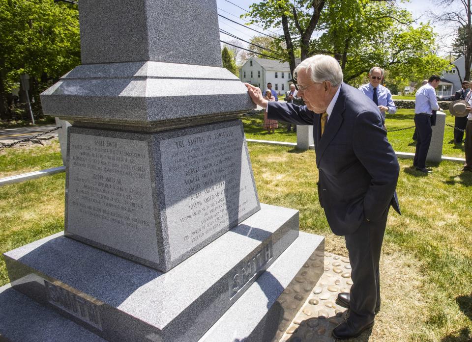 President M. Russell Ballard gets a closer look at the Smith Family Memorial following its dedication ceremony at Pine Grove Cemetery in Topsfield, Massachusetts.