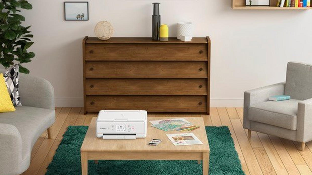  The best all-in-one printer sat on a table in a relaxed looking living room.  