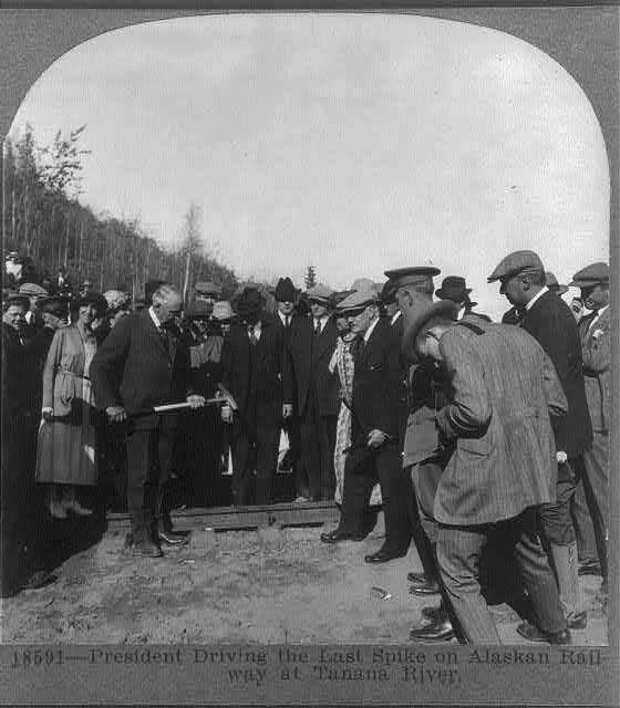 President Warren Harding driving the last spike on Alaskan Railroad at Tanana River.