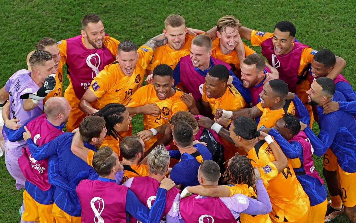 Netherlands players celebrate/Netherlands vs USA, World Cup 2022 result: Dutch silence critics to reach quarter-finals - Dutch silence critics to reach quarter-finals as American dream dashed - Giuseppe Cacace/AFP