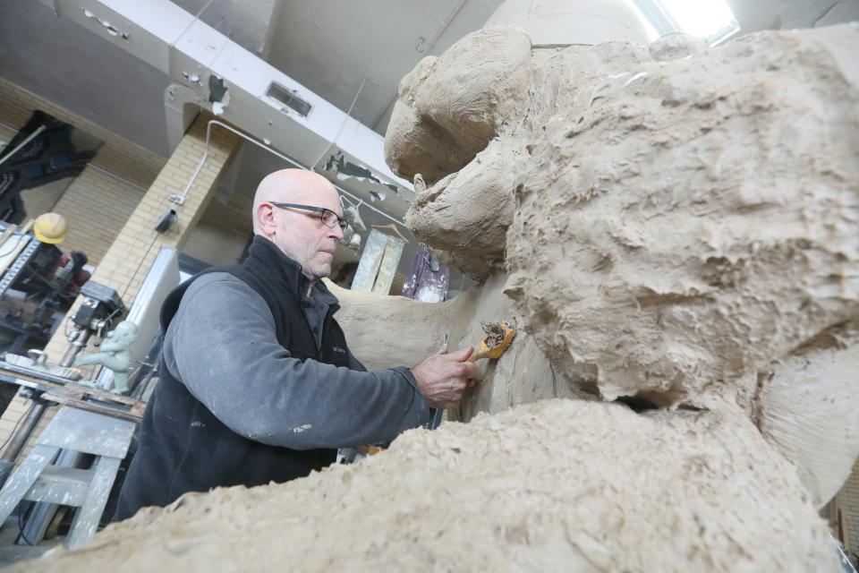 Sculptor Alan Cottrill works on a statue of Massillon Tigers mascot Obie in his Zanesville studio. The 8-foot bronze statue is expected to be placed in downtown Massillon. The statue is funded by an anonymous donor.