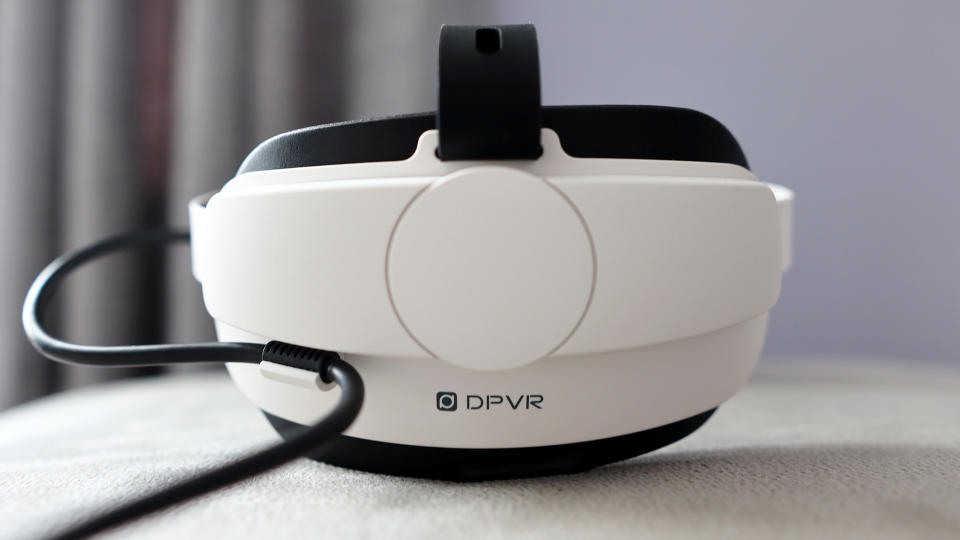 DPVR E4 virtual reality headset with controllers from various angles.