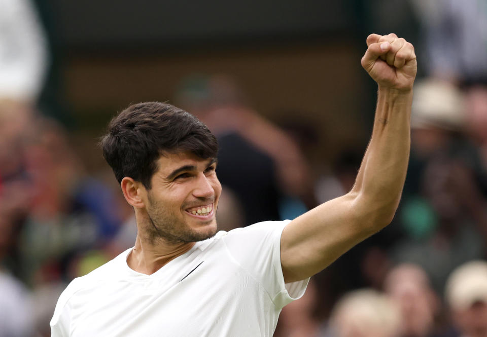 LONDON, ENGLAND - JULY 09: Carlos Alcaraz of Spain celebrates winning match point against Tommy Paul of United States in the Gentlemen's Singles Quarter Final match during day nine of The Championships Wimbledon 2024 at All England Lawn Tennis and Croquet Club on July 09, 2024 in London, England. (Photo by Clive Brunskill/Getty Images)