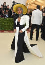 <p>Monae ensured that her Marc Jacobs dress worked within her black and white color scheme, but added a pop of color with a hat. (Photo: Getty Images) </p>