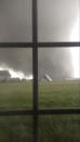 An active tornado is seen through a window as it touches down in Washington, Illinois on November 17, 2013, in this still image captured from a video courtesy of Anthony Khoury. A fast-moving storm system spawned multiple tornadoes in Illinois and Indiana, threatening some 53 million people across 10 Midwestern states on Sunday, U.S. weather officials said. Washington, Illinois is located 145 miles (233 km) southwest of Chicago. REUTERS/Anthony Khoury/Handout via Reuters (UNITED STATES - Tags: DISASTER ENVIRONMENT) ATTENTION EDITORS - THIS IMAGE HAS BEEN SUPPLIED BY A THIRD PARTY. IT IS DISTRIBUTED, EXACTLY AS RECEIVED BY REUTERS, AS A SERVICE TO CLIENTS. NO SALES. NO ARCHIVES. FOR EDITORIAL USE ONLY. NOT FOR SALE FOR MARKETING OR ADVERTISING CAMPAIGNS. MANDATORY CREDIT