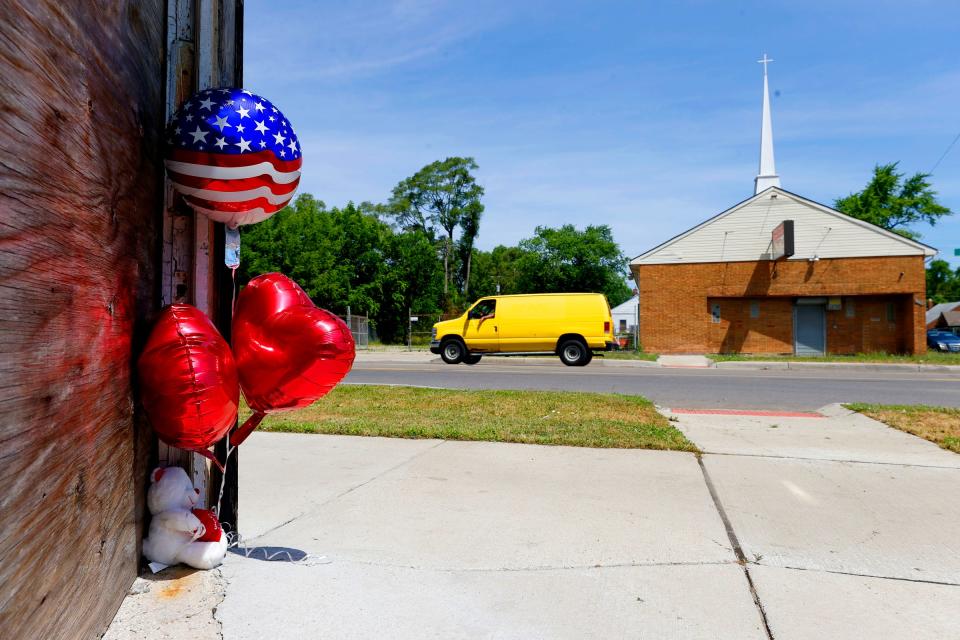 A small memorial at a two-story building at Joy Road and Marlowe Street in Detroit on Thursday, July 7, 2022, near where Loren Courts, a five-year veteran of the Detroit Police Department, was shot and killed in the intersection by a man with an assault rifle on Wednesday evening.