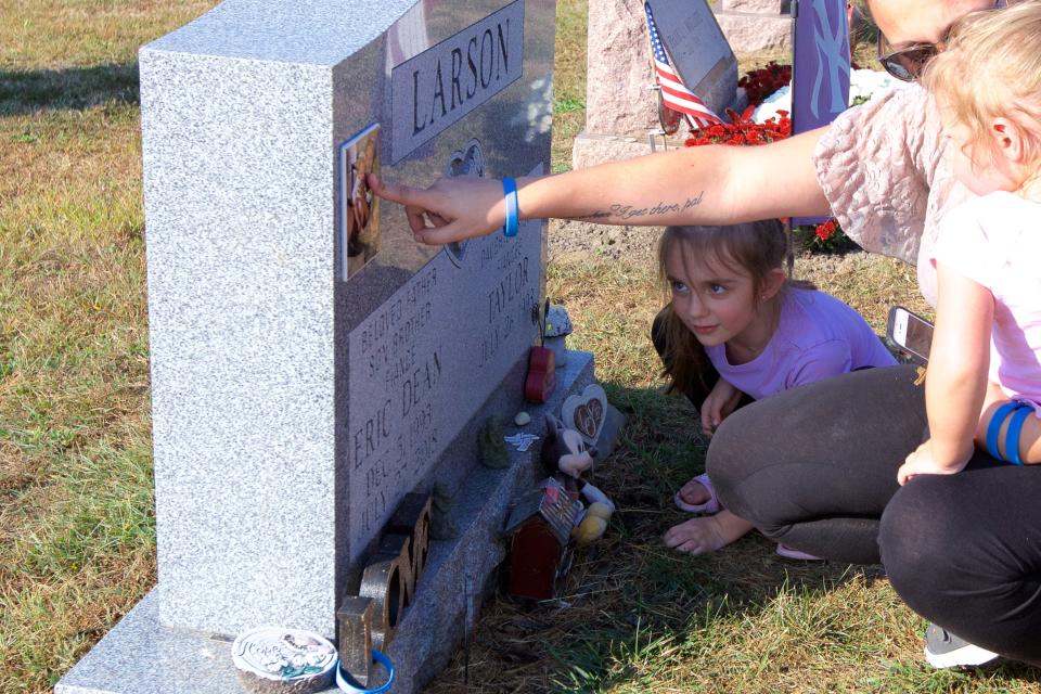 Taylor Bromberg, 26, visited the grave of her fiancé Eric Larson  with her daughters, Adriana Nicole, 5, and  Mikayla Grace, 2. Larson was killed by a suspect fleeing police.