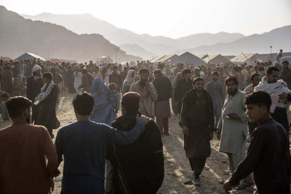 Afghan refugees settle in a camp near the Torkham Pakistan-Afghanistan border in Torkham, Afghanistan, Saturday, Nov. 4, 2023. A huge number of Afghans refugees entered the Torkham border to return home hours before the expiration of a Pakistani government deadline for those who are in the country illegally to leave or face deportation. (AP Photo/Ebrahim Noroozi)