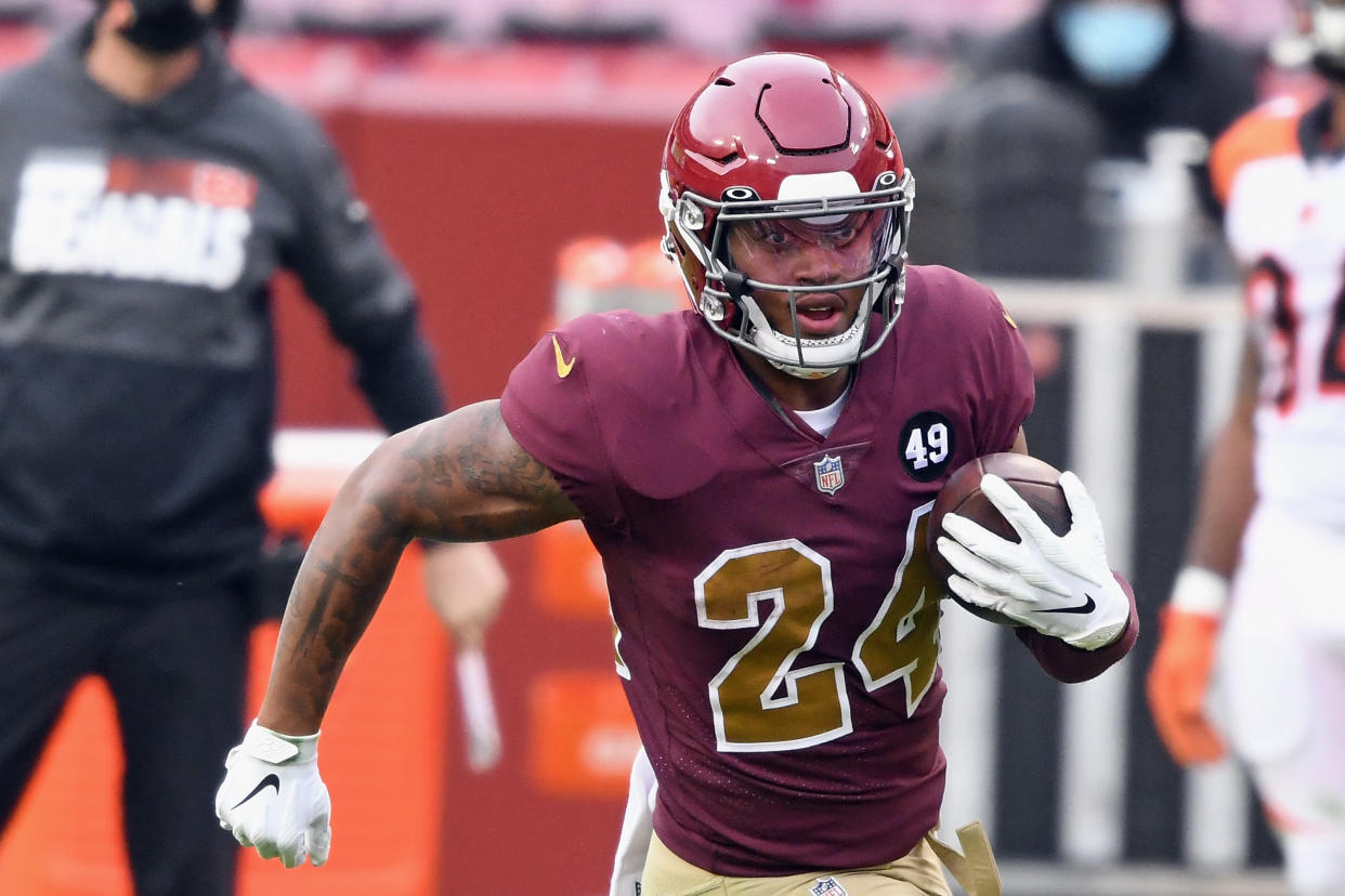 LANDOVER, MARYLAND - NOVEMBER 22: Antonio Gibson #24 of the Washington Football Team carries the ball against the Cincinnati Bengals during the second half at FedExField on November 22, 2020 in Landover, Maryland. The Washington Football Team defeated the Bengals 20-9. (Photo by Mitchell Layton/Getty Images)