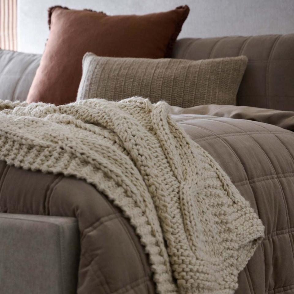 joanna gaines magnolia fall collection bedroom, close up of the bed with a cream colored throw