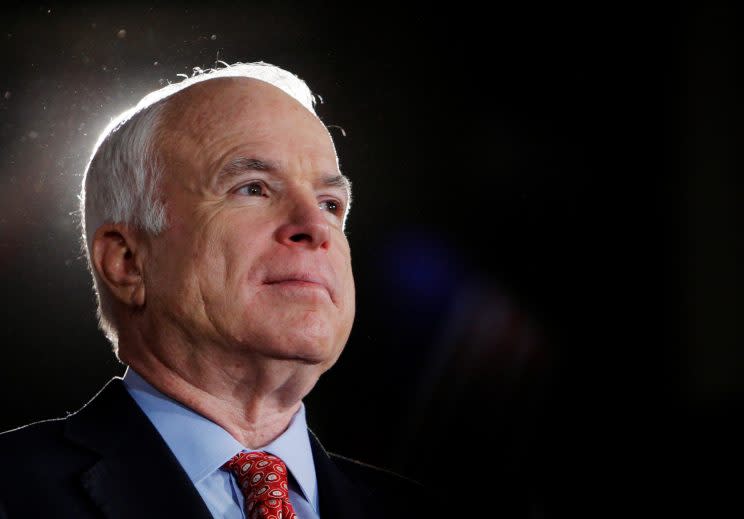 Republican presidential nominee Senator John McCain (R-AZ) listens as he is being introduced at a campaign rally in Denver, Colorado October 24, 2008.