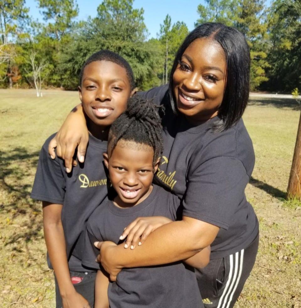 Zaire Person poses with his mom, Khrysten Cunningham.