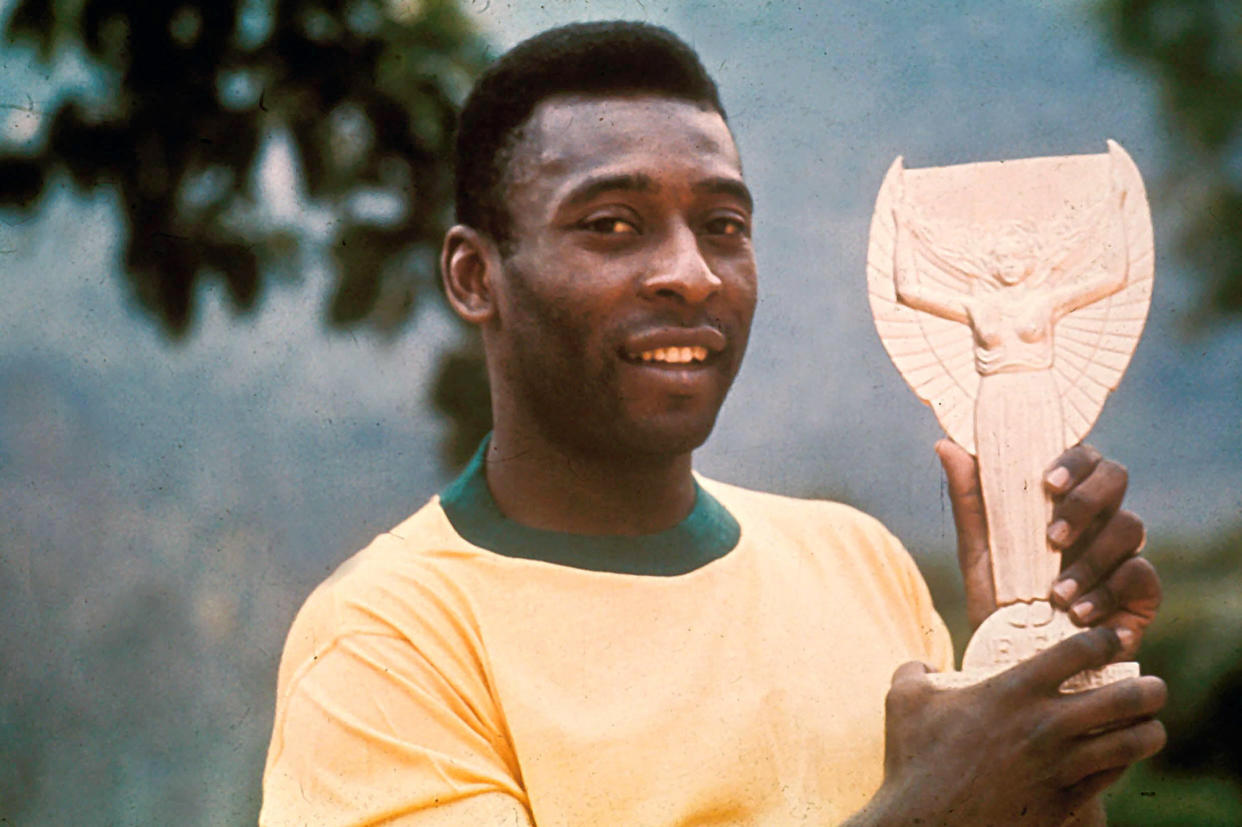 Pele with the Jules Rimet World Cup winner's trophy in 1970. (Action Plus Sports Images / Alamy)