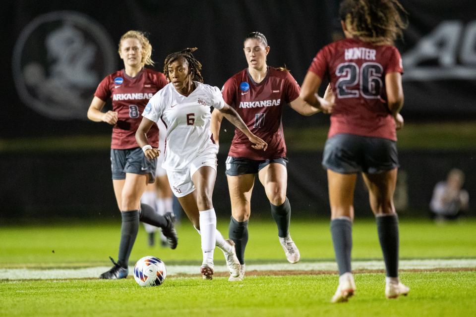 Florida State Seminole Onyi Echegini (6) works the ball towards the goal. The Florida State Seminoles defeated the Arkansas Razorbacks 1-0 in an Elite Eight matchup Saturday, Nov. 26, 2022.