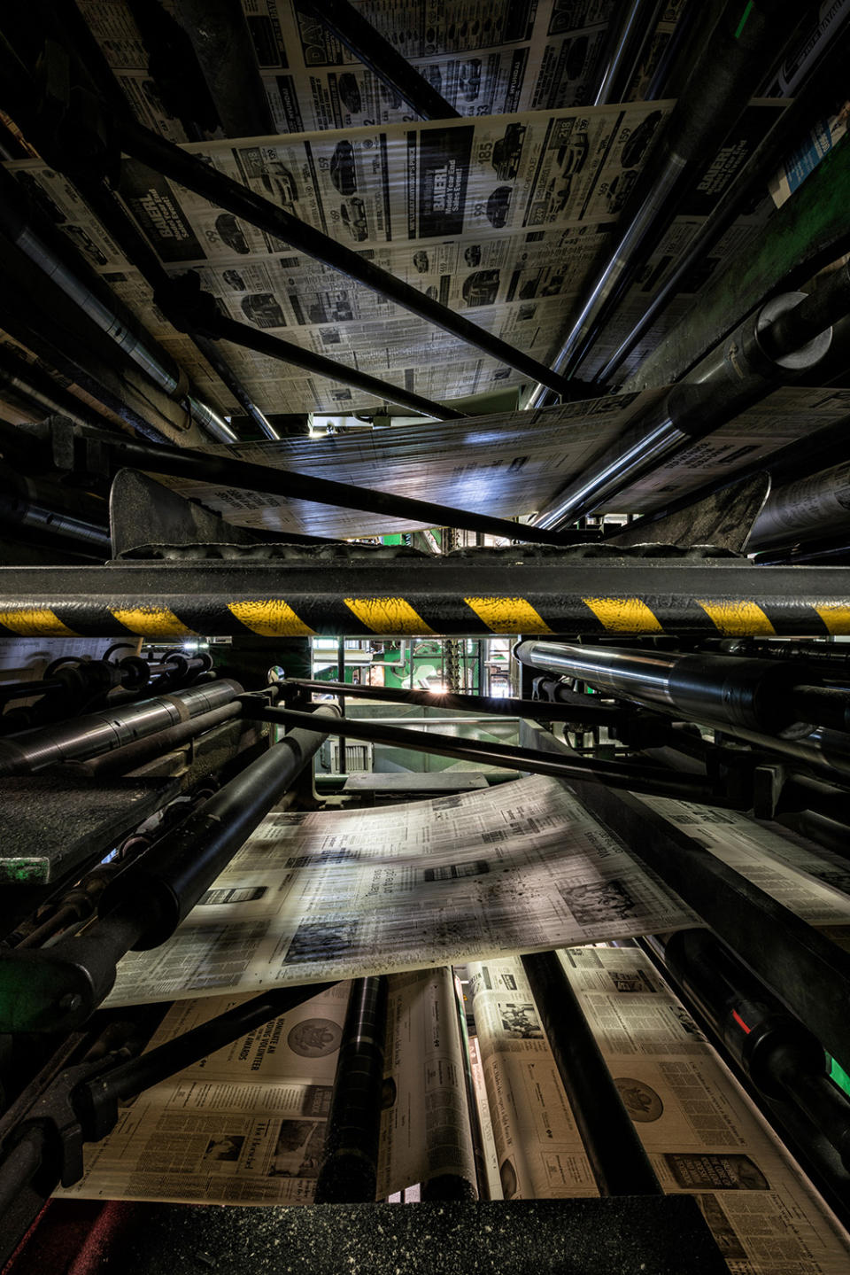 Stop the presses! Photographer documents newspaper’s eerie abandoned printing presses.