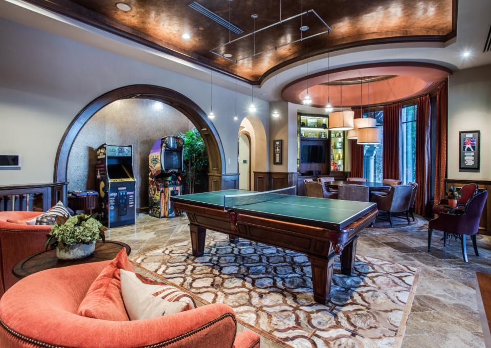 The game room with billiards and arcade.