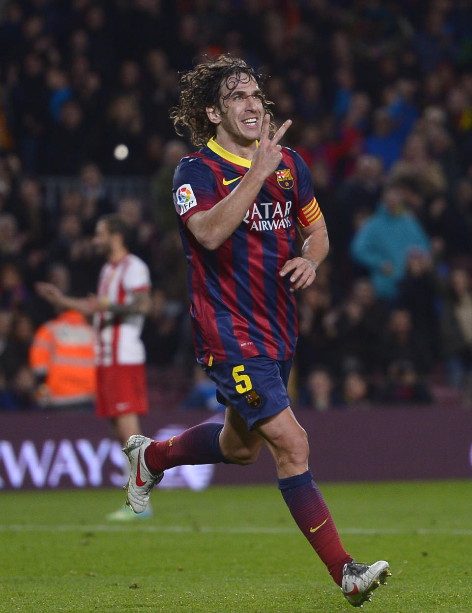 FC Barcelona's Carles Puyol reacts after scoring against Almeria during a Spanish La Liga soccer match at the Camp Nou stadium in Barcelona, Spain, Sunday, March 2, 2014. (AP Photo/Manu Fernandez)