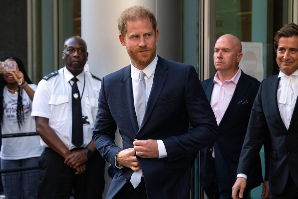 <p>Carl Court/Getty </p> Prince Harry leaves a London court after giving evidence on June 7, 2023