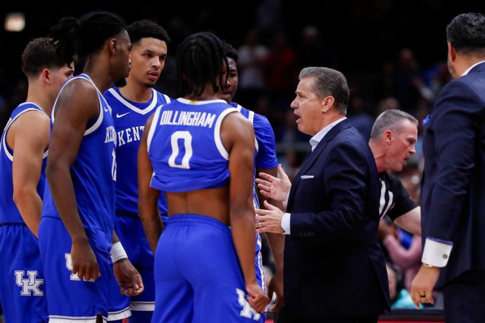 John Calipari talks with his team in the final seconds of Tuesday night’s loss. “I got to do a really good job of showing them how to finish games,” the UK coach said of his youthful squad. “… None of us are happy that we lost the game. I’m not happy.”