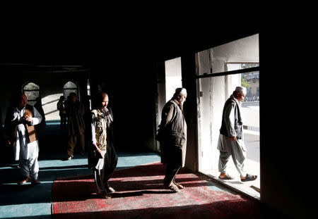 Afghans walk inside a Shi'ite Muslim mosque after yesterday's attack in Kabul, Afghanistan August 26, 2017.REUTERS/Mohammad Ismail