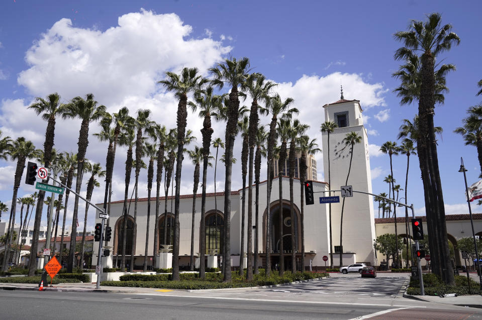 The exterior of Union Station in Los Angeles appears on March 23, 2021. The Oscars are headed to the historic site for the first time this year. With wide open spaces and 65-foot high ceilings, it’s ideal for a big crew and cameras. It’s been used in car commercials, reality shows and procedurals. But its beamed ceilings, Spanish tile floors and regal bronze chandeliers really shine in cinema where it’s played train stations, banks, police stations, clubs and airports. (AP Photo/Chris Pizzello)